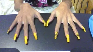 Black n yellow nails in table