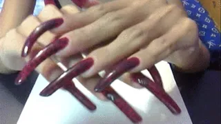 Deep red with dots nails close up