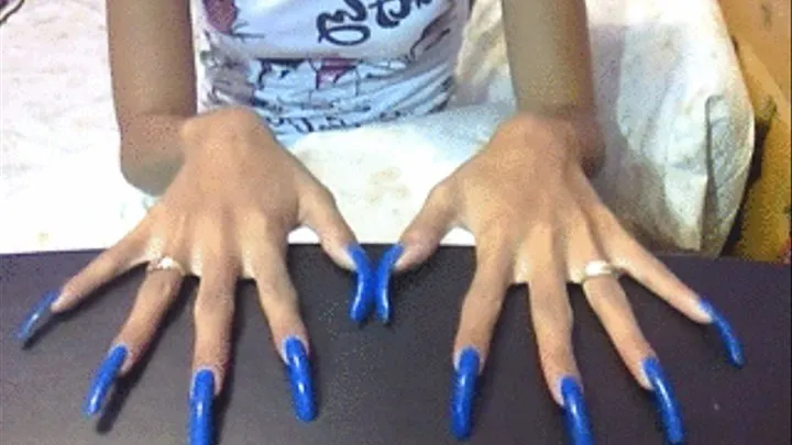 Neon blue long nails in table..