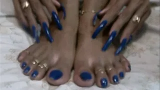 Neon blue long nails and toes..