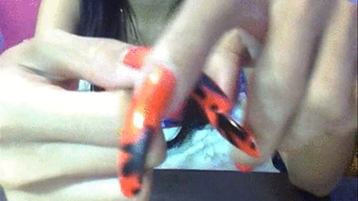 Orange with black design nails caressing..