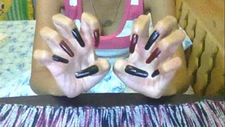 Black red nails scratching air..