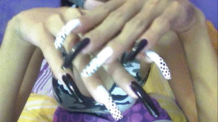 Dark and dots nails close up..