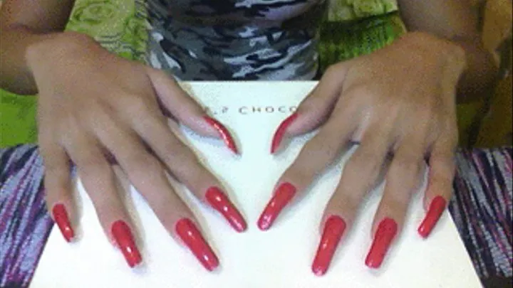 Shiny red nails in flat surface..