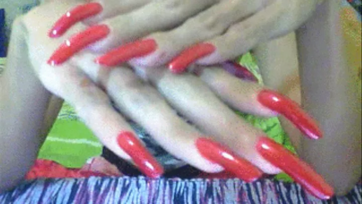 Shiny red nails close up..