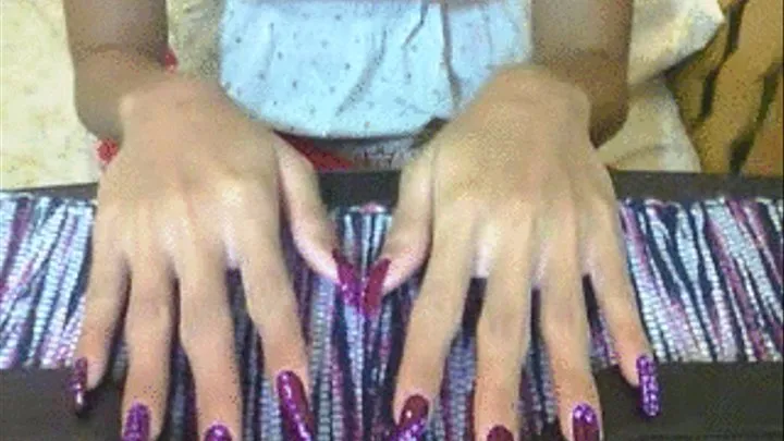 Purple with dot nails in flat surface..