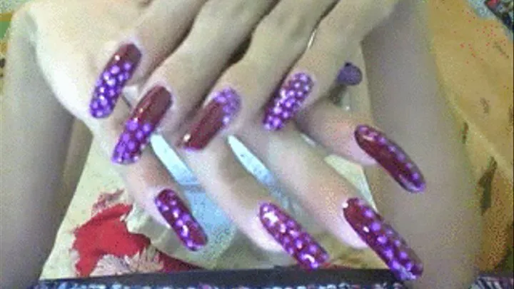 Purple with dot nails close up..