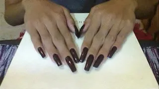 Chocolate brown nails in flat surface..