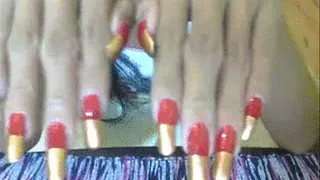 Red and bronze nails close up