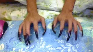 Dark brown nails tapping..