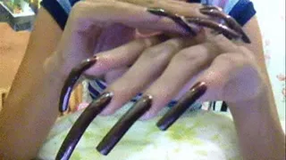 Dark brown nails close up..