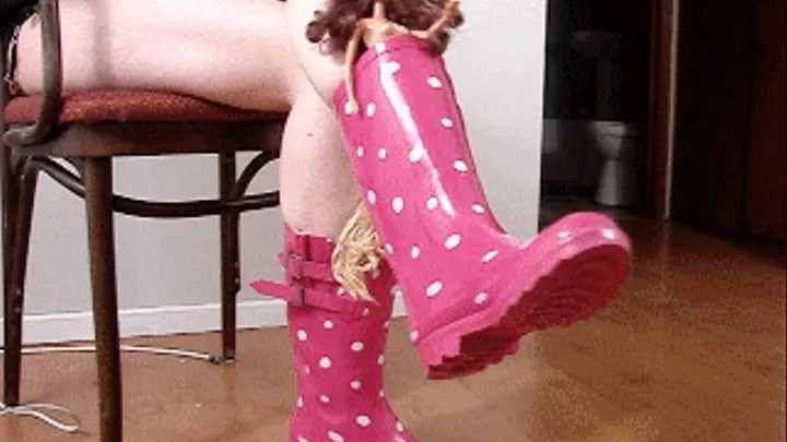 Lilith dangling her barbies in her rubber rainboots nov29 2010