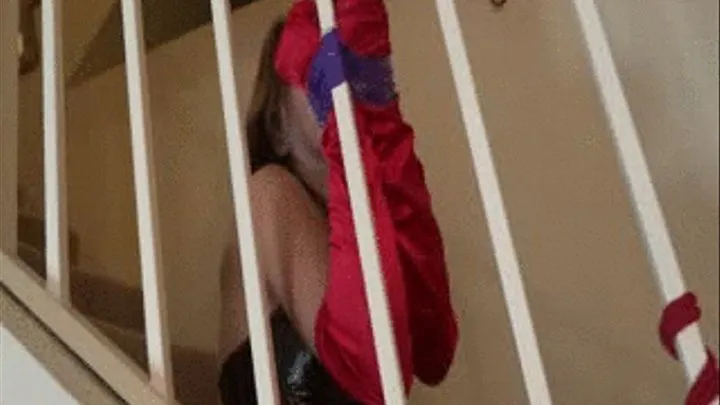 Sexy Super Villain Bound to Staircase!