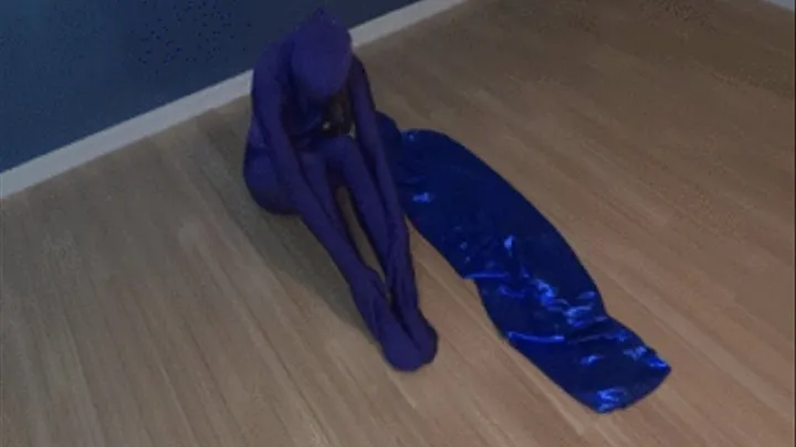 Zentai babe gets in Mummy Bag