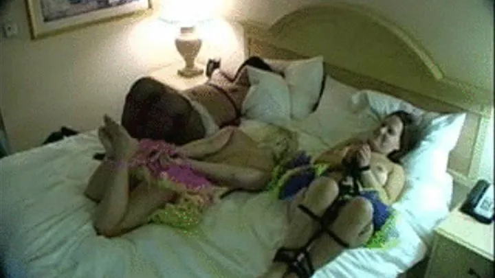 2 Topless Girls Tied in Bed