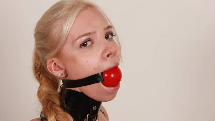 Huge red ball gag and tight armbinder