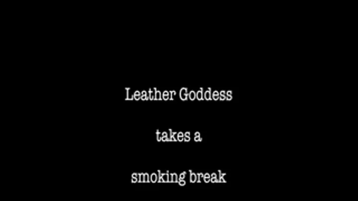 Leather Mistress takes a smoking break