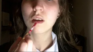 Schoolgirl Puts On Red Lipstick