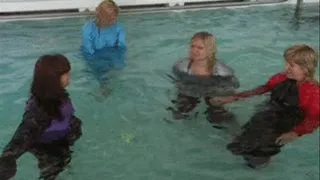 4 girls in Saunasuits playing in a pool