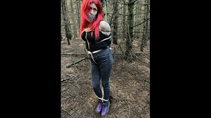 Shelly Frayja Tied To a Tree