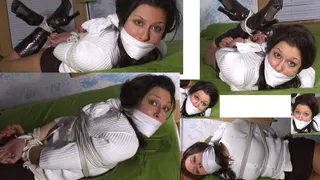 Over the mouth cloth gag fastened tightly over her already gagged mouth that is gagged with panties