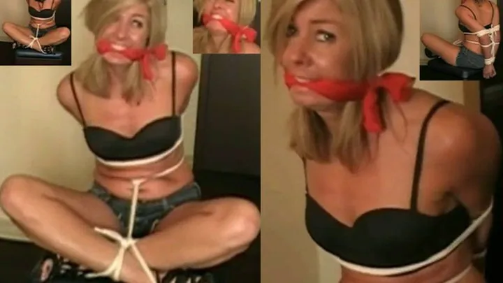 My friend has the sexy neighborhood MILF bound and gagged while she is wearing her tightest shorts