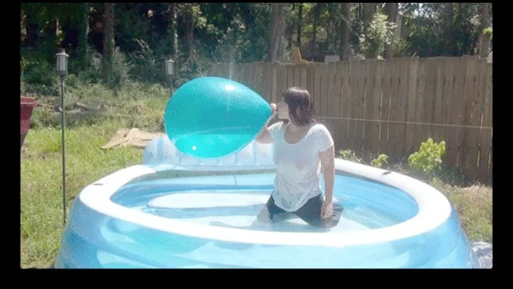 Galas Blow to Pop Teal Balloon in Inflatable Pool