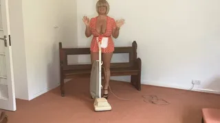 Vacuuming in red and white check outfit!