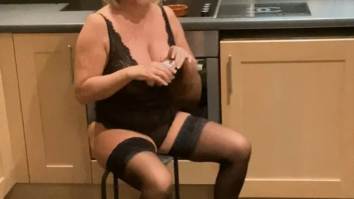 Smoking in black lace in kitchen