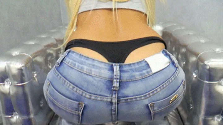 Thong behind blue jeans