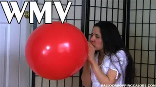 Hanna blows up a 24 inch red balloon