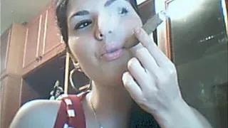 Sexy brunette trying to smoke a BIG cig