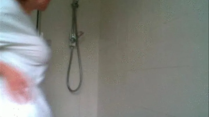 Kelly Hart showers in a t.shirt!