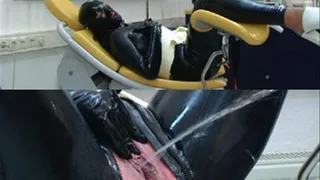 Hot enema in full rubber outfit on the gynchair