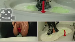 Horny rubber fetish in the bathtube