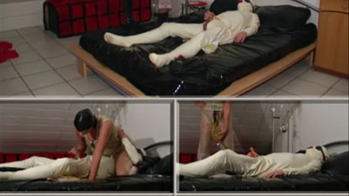 The rubberslave on the rubberbed - kinky treatment