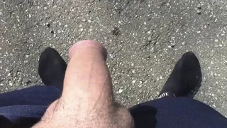 guy pissing on the road outdoors -- Ragazzo che piscia sulla strada all'aperto