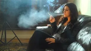 JULIE SMOKES WEARING LEATHER JACKET