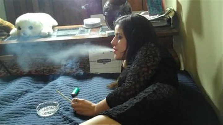 JULIE SMOKES A 120 ON THE BED..!