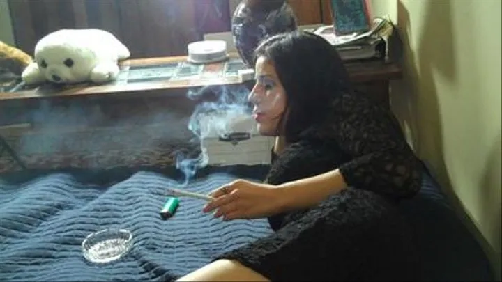 JULIE SMOKES ON BED (angle)