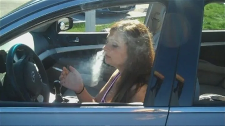 Katie Smokes in the car