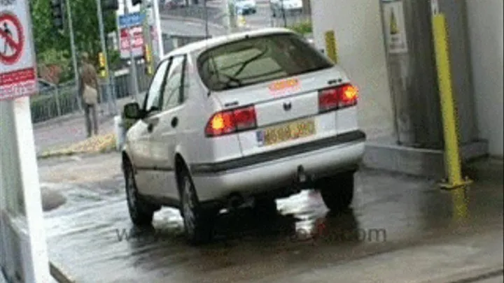 Babe at Carwash in Shiny PVC