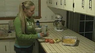 Ashley squishes tomatoes, banana an peaches