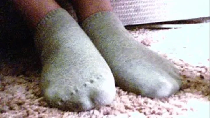 Dirty gray socks under the table