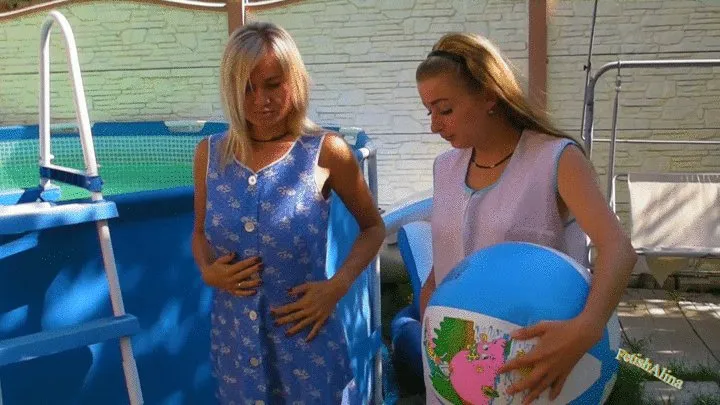 Christina and Nikki in smocks playing in a pool