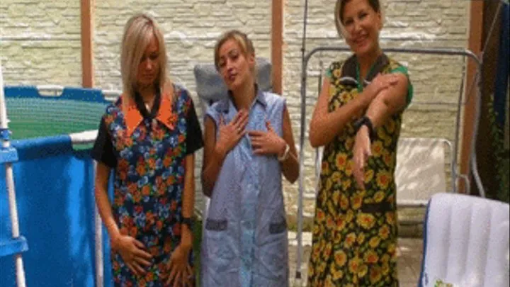 3 girls washing their smocks in a pool