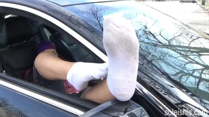 Gorgeous model Nikki shows off her sexy, high arched STINKY and SWEATY feet right out of her well worn socks on the car mirror! Clip 1