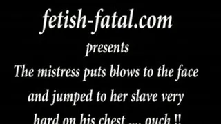 The mistress puts blows to the face and jumped to her slave very hard on his chest .... ouch!!......La maitresse met des coups au visage à step-son esclave et saute très fort sur step-son torse .... !!!