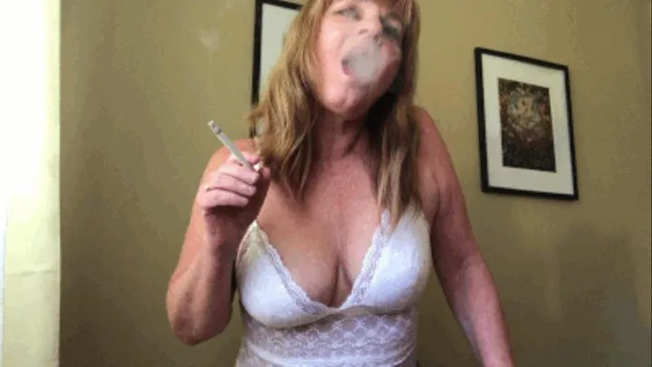 Smoking flicking ash on your hard cock