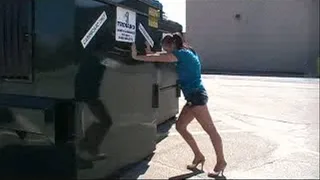 APRIL STRUGGLING TO PUSH DUMPSTER